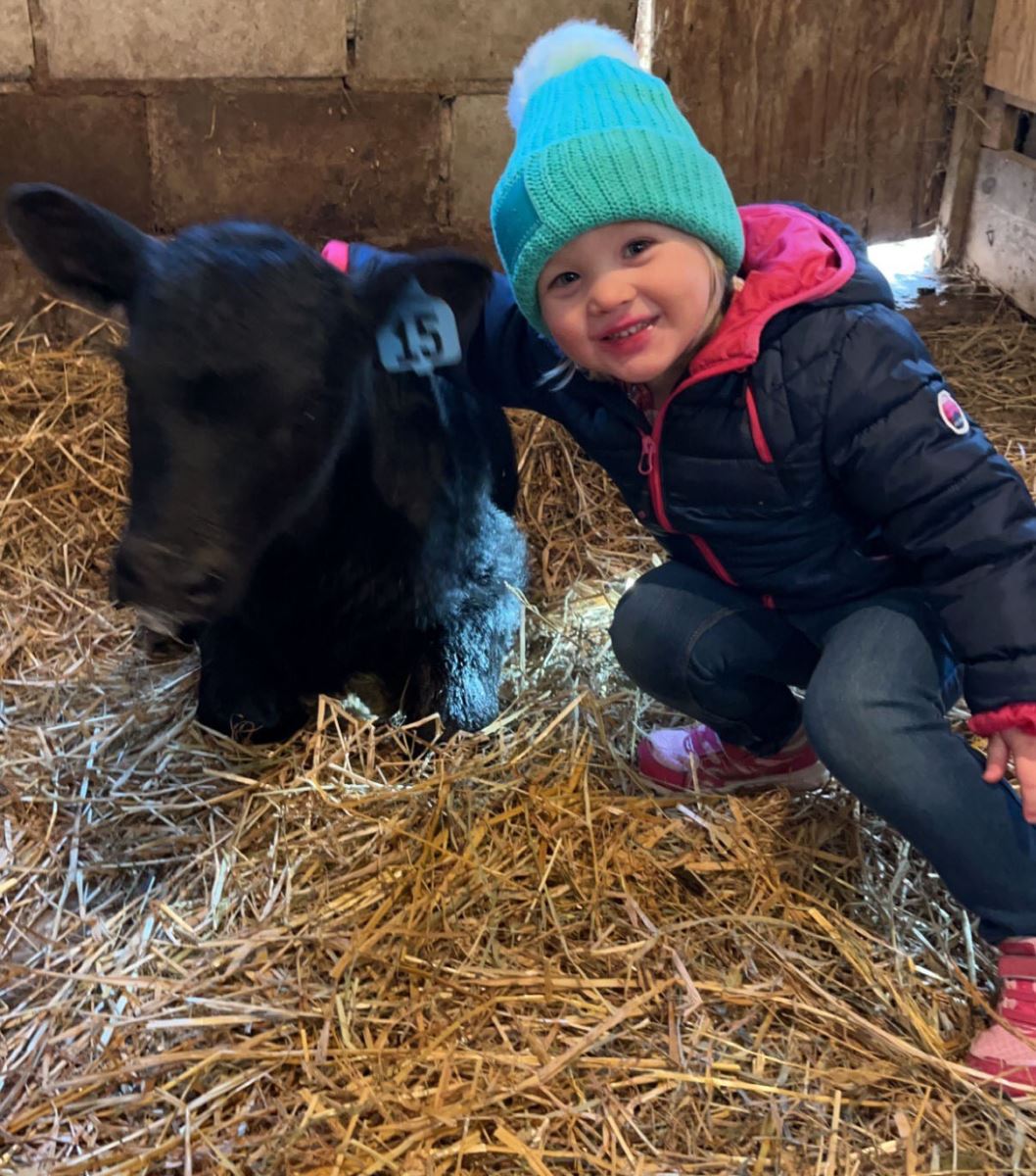 Cody's niece and a new calf